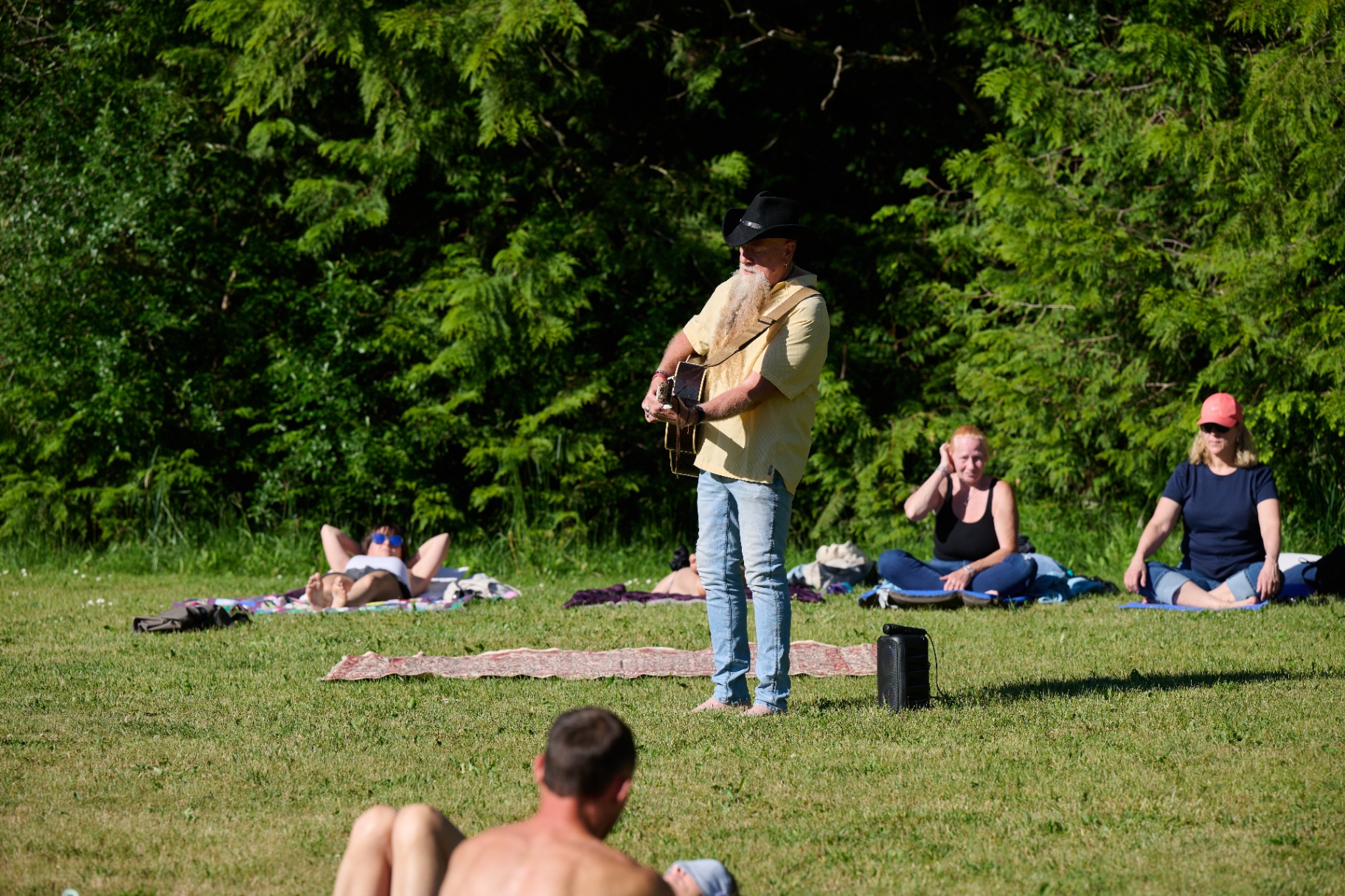 Tim playing guitar during a sunrise sound healing