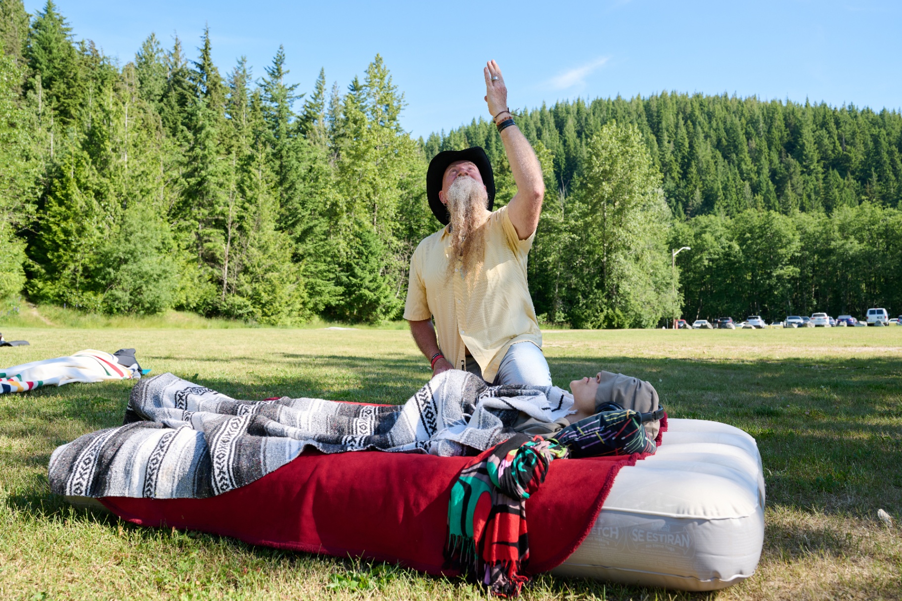 Tim guiding a sound-healing session at sunrise